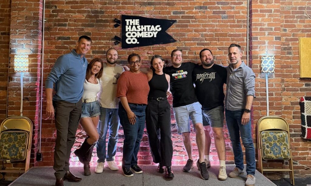 Phil with his improv troupe on stage at The Hashtag Comedy Co.