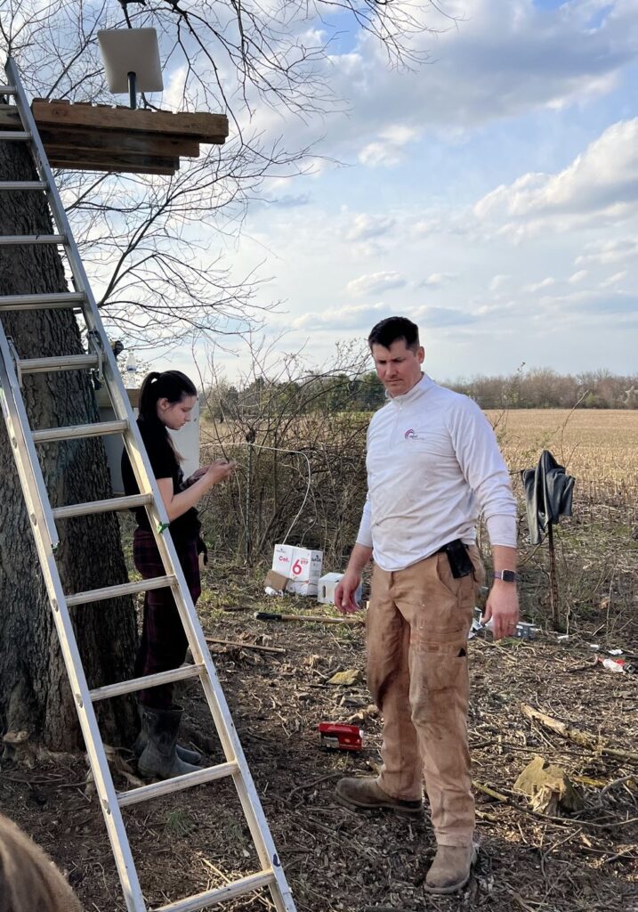 Phil building a tree stand at the farm