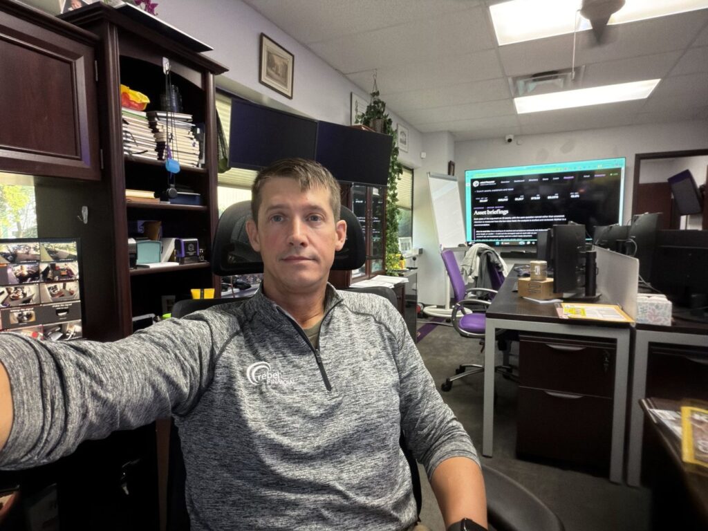 Phil at his desk in the rebel Financial office