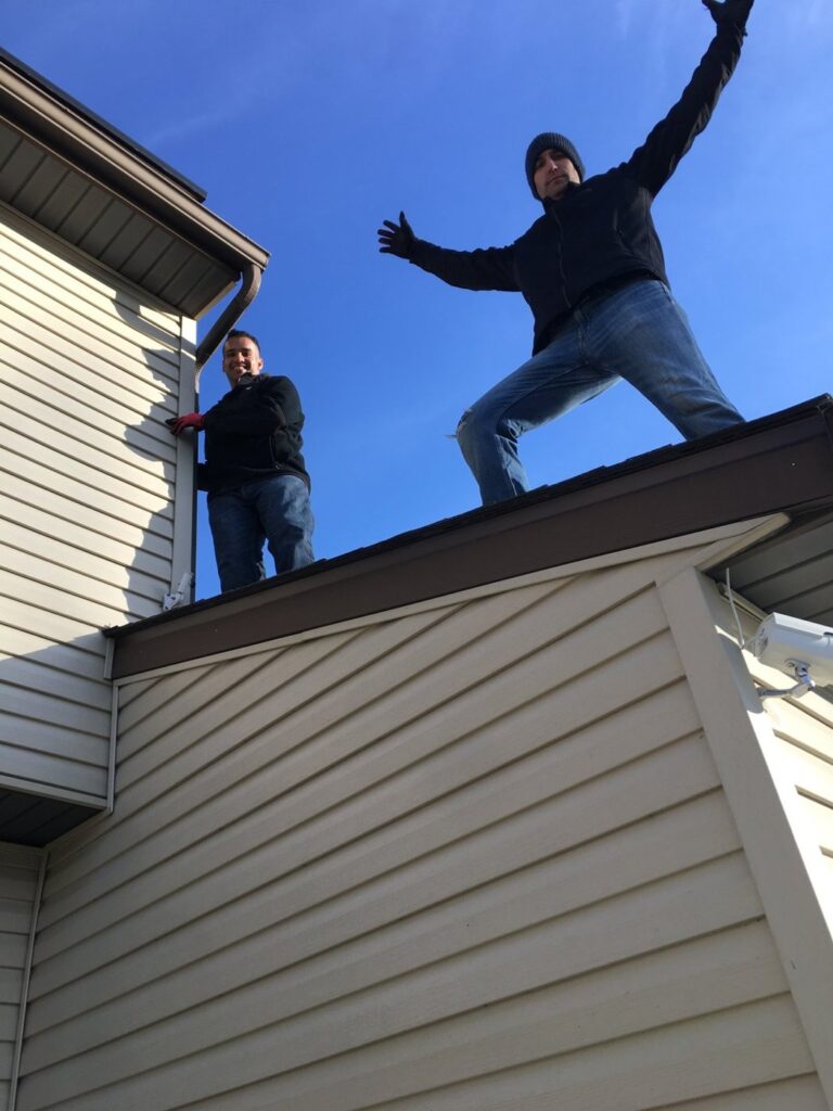 Phil up on the roof installing solar panels